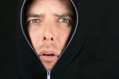 Dismayed man looks to camera Stock Photos