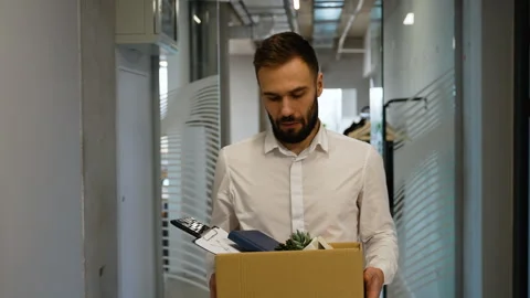 Dismissed worker leaving or resign or dismiss from job, man carry personal box Stock Footage 262406367