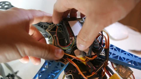 Dismounting flight controller from used drone Stock Footage 98421109