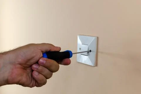 Dismounting an old light switch Stock Photos