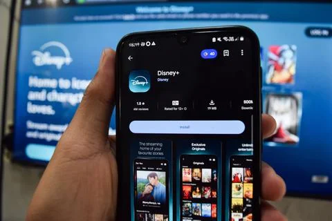 Disney plus dev application on Smartphone screen. Disney is a freeware web Fotos de archivo