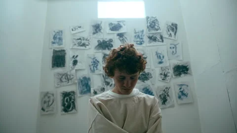 Disoriented Patient in Straitjacket Rocking Back and Forth in Psychiatric Ward Stock Footage 313251883