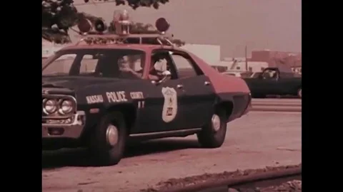 Dispatch alerts a patrol car to an emergency in their area in 1975. Video stock 137523634