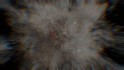 The dispersion of light from the explosion can be seen around the edges of a Stock Footage 239883979