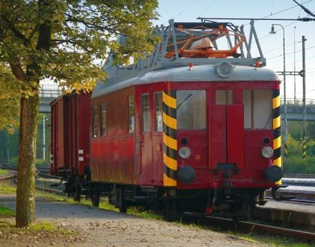 Displaced old red train electric waggon Stock Photos