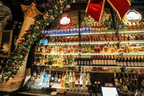 Display of alcohol bottles arranged behind the bar Stock Photos