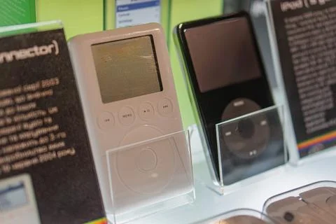 Display of Apple iPod models in glass cases, showcased for promotional or his Stock Photos