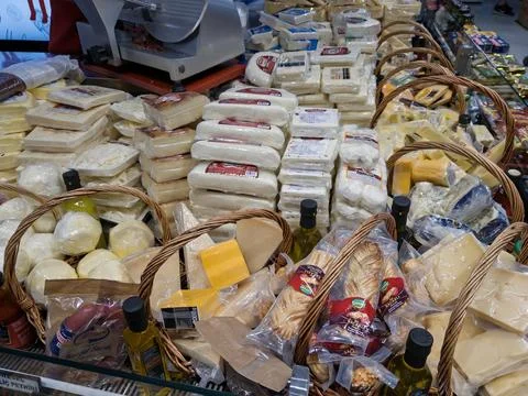 Display of Assorted Cheeses and Dairy Products at a Local Market During the Stock Photos