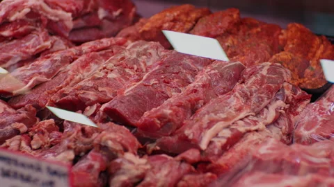 Display of assorted chopped raw lamb meat in butchers shop for sale. Stock Footage 295272373