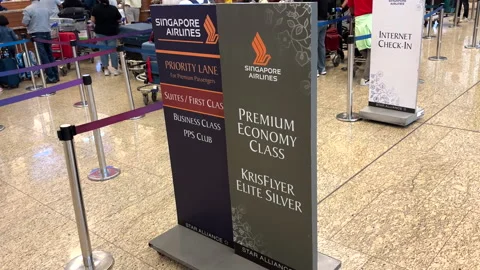 Display board for First, Business and Premium Economy Class at check-in counter. Stock Footage 314018568