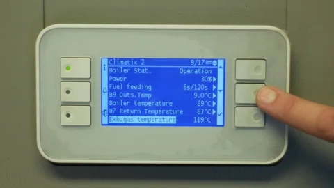 Display boiler finger hand in setting temperature indicators, fire burn pellets Stock Footage 100686565
