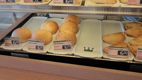 Display Case of Bread Rolls and Pastries With Price Tags, Pão de Açúcar, Brazil Stock Footage 306488620