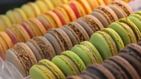 Display case decorated with neat rows of sweet almond macaroons Sweet cakes of Stock Footage 276320459