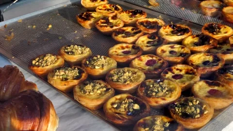 A display case with fresh, fragrant baked goods attracts the attention Stock Footage 305603718