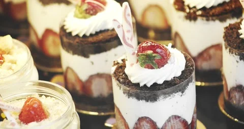 A display case with gorgeous strawberry and buttercream cakes. Stock Footage 255839171