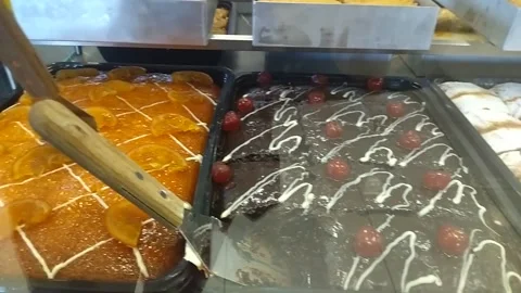 Display case with Greek Sweets and Various Cakes Stock Footage 303648982