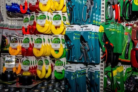 On a display case in a hardware store weigh colored reels with fishing line f Stock Photos