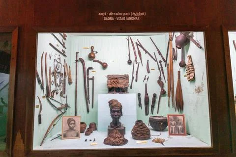 A display case with a man's head and other items. in Chennai Stock Photos