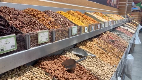 Display case with nuts, many types, pistachios, peanuts Stock Footage 277994752