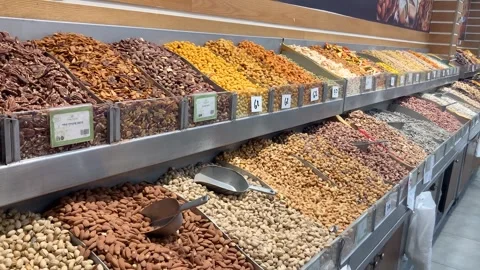 Display case with nuts, many types, pistachios, peanuts Stock Footage 277994763