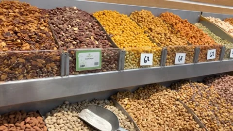 Display case with nuts, many types, pistachios, peanuts Stock Footage 277994783