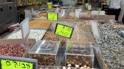 Display case with nuts, many types, pistachios, peanuts Stock Footage 277995076