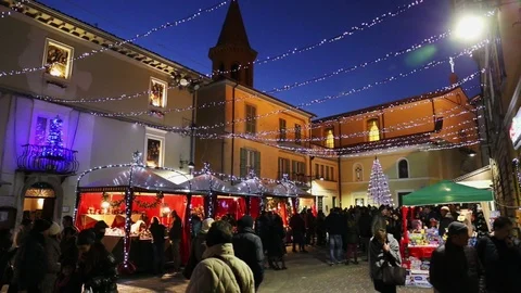 Display of Christmas objects in a square full of people Stock Footage 95402734