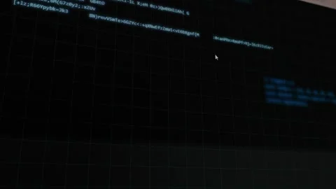 Display of coding process and program development on screen in a dimly lit room Stock Footage 332096255