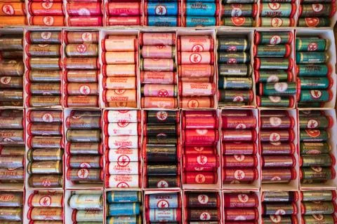 Display of colorful spools of threads at a store. Stock Photos