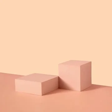 Display concept with rectangular pedestals on neutral beige Stock Photos