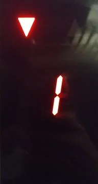 The display of the elevator car with the number 1 and the down arrow. Close-u Stock Photos