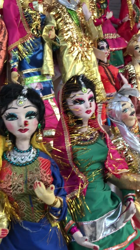Display of fabric dolls dressed as brides and grooms Stock Footage 222951469