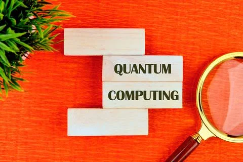 A display focuses on quantum computing, featuring wooden blocks arranged with Stock Photos