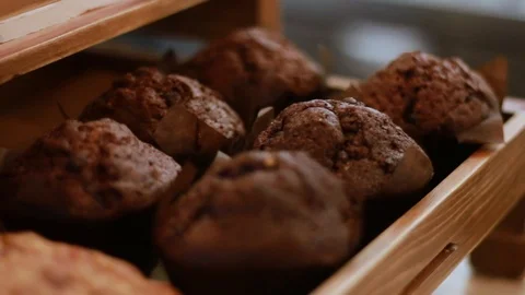 Display Of Freshly Baked Choc Chip Cookies In Coffee Shop Stock Footage 100143873
