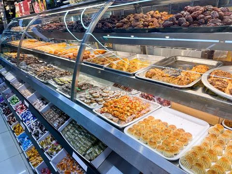 Display of freshly prepared Middle Eastern pastries and sweets in a bakery Stock Photos
