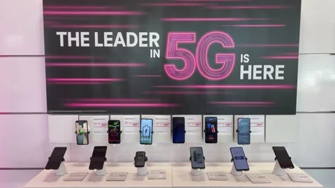 A display of Google, Apple, Samsung, Moto, OnePlus, Alcatel, and RevvL Cellph Stock Footage 163992732