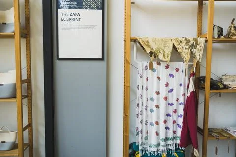 Display of handmade ecoprint textiles and woven bags in a boutique shop Stock Photos