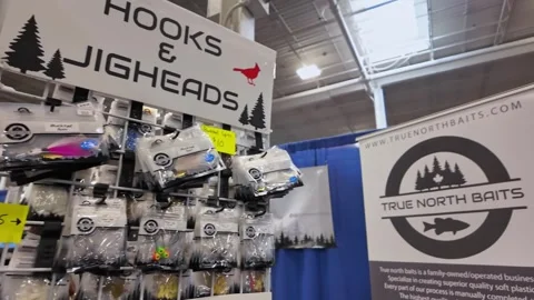 Display of hooks and plastic lures for fishing inside Canadian sport store... Stock Footage 311270957