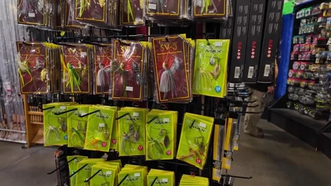 Display of hooks and plastic lures for fishing inside Canadian sport store... Stock Footage 311270960