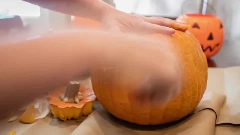 Display of large jack-o'-lantern made from traditional carved pumpkin with li Stock Footage 272458825