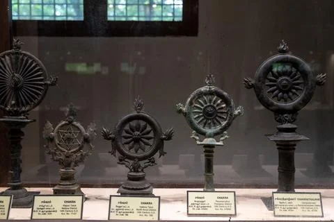 A display of old metal objects with a sign that says "Thai" on it. in Chennai Stock Photos