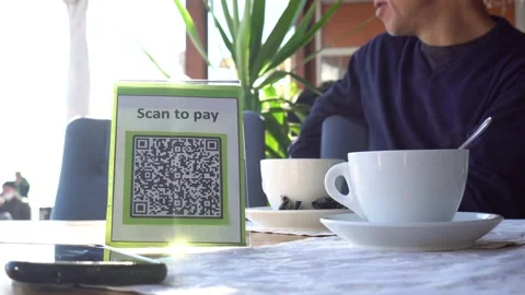 Display with qr code on the table in the restaurant. Contactless payment Stock Footage 150411228