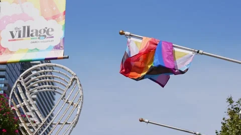 Display of Rainbow Flag Proudly Soaring in the Sky Stock Footage 257098430
