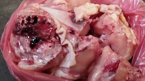 Display of raw chicken meat that has just been purchased from the market Stock Footage 226731612