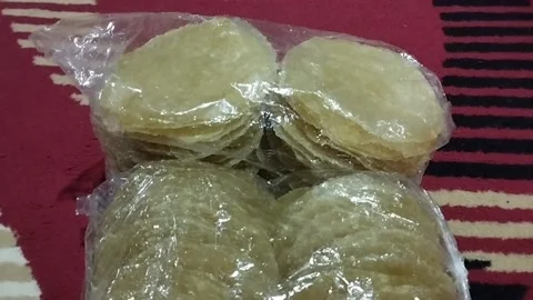 Display of raw rice crackers wrapped in plastic Stock Footage 226587471