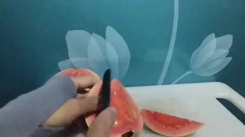 Display of red crystal guava fruit that is cut obliquely Stock Footage 229252720