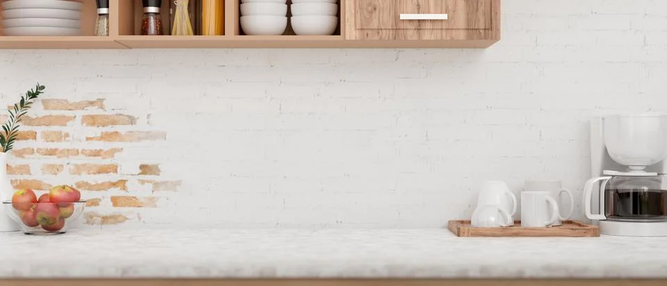 A display space on a kitchen tabletop features a coffee maker machine again.. Stock Photos