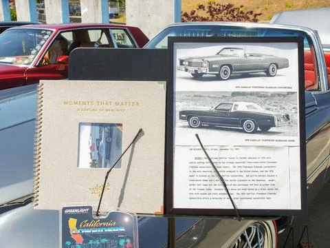 Display stand with memories book and vintage photos at an outdoor classic c.. Stock Photos