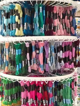Display Stand with multi-colored bright floss threads for embroidery - sale.. Stock Photos