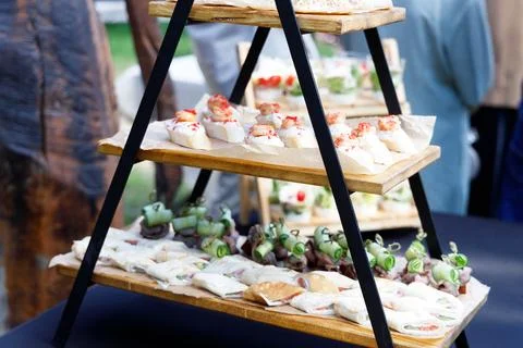 A display stand set up with appetizers and canapes for a banquet table Stock-Fotos